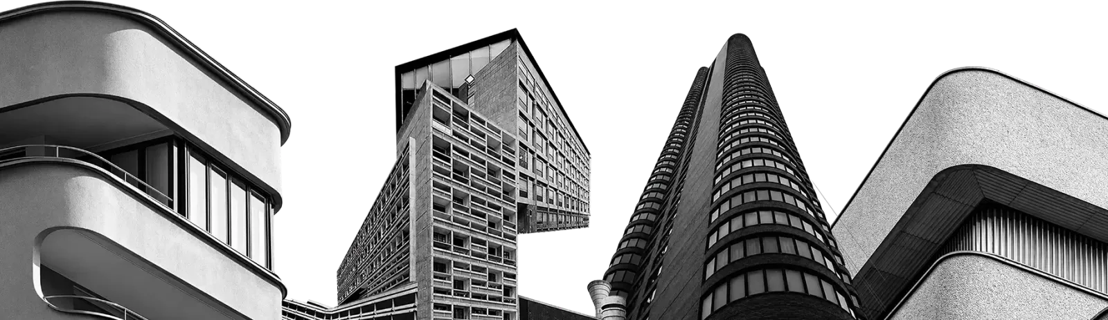 A concrete apartment tower shot from below in black and white