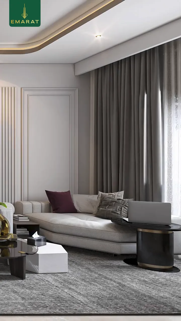 Reel poster: living room with grey curtains, a cream sofa, maroon cushion and a laptop on a side table