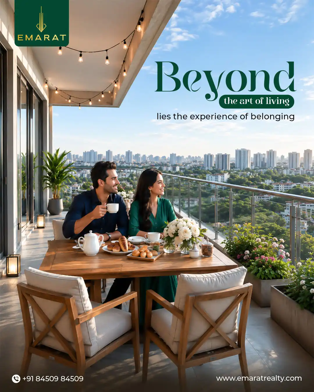 Couple sharing tea and pastries at a balcony table over a city skyline, headline "Beyond the art of living"