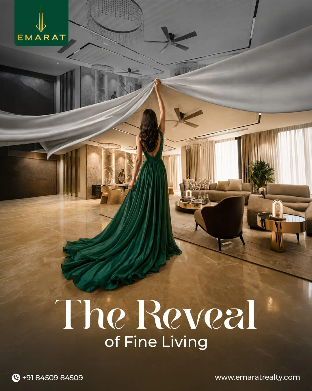 Woman in an emerald gown lifting a grey drape across a marble living room, headline "The Reveal of Fine Living"