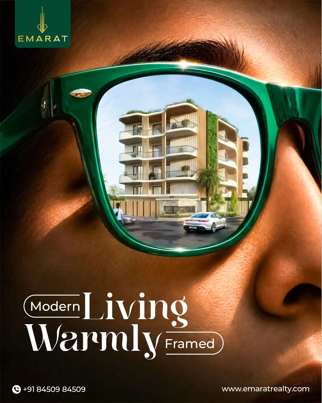 Close-up of a face wearing green sunglasses whose lens reflects a balconied apartment building, "Modern Living Warmly Framed"