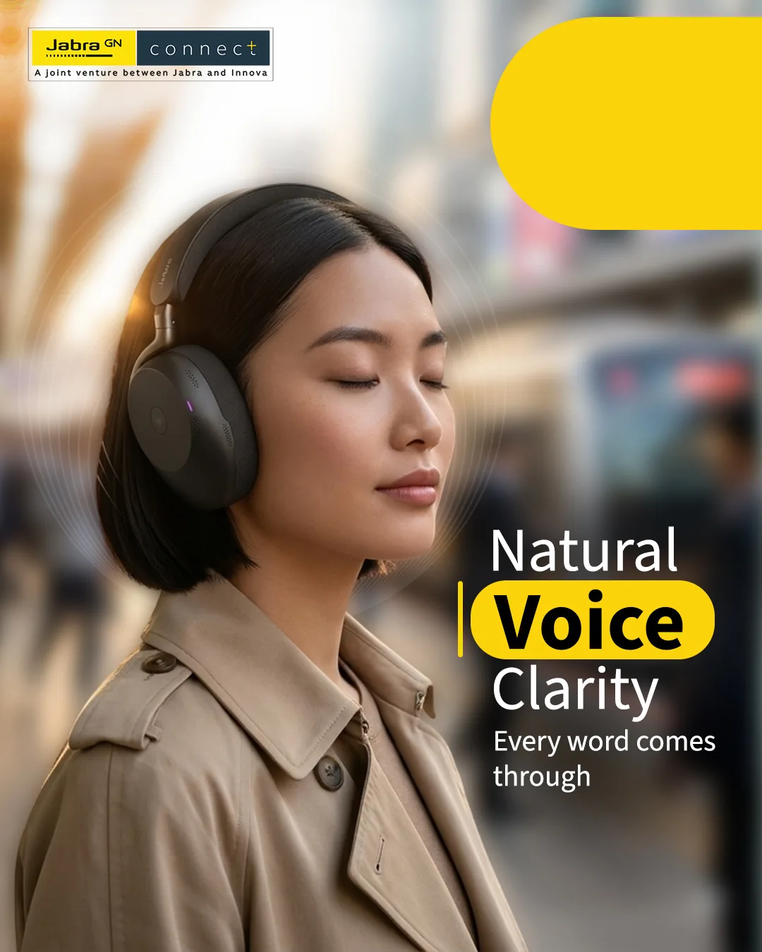 Woman with eyes closed in a beige trench coat and black headphones on a blurred city street, headline Natural Voice Clarity