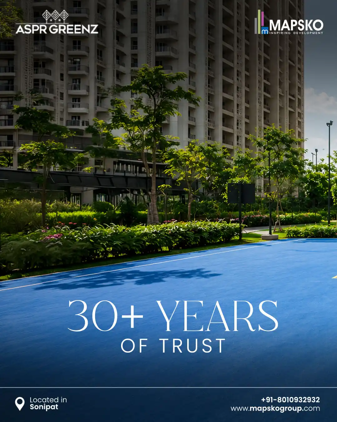 ASPR Greenz post reading 30+ years of trust, over a tall residential tower behind landscaped greenery and a blue sports court